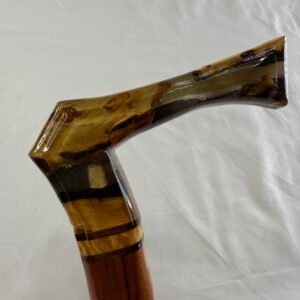 Full length view of spalted resin walking cane with alternating wood inlay stripe on walnut shaft