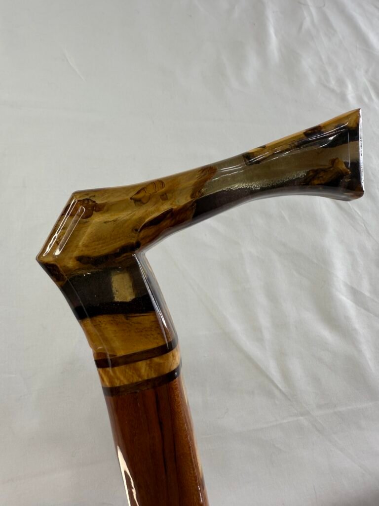Full length view of spalted resin walking cane with alternating wood inlay stripe on walnut shaft
